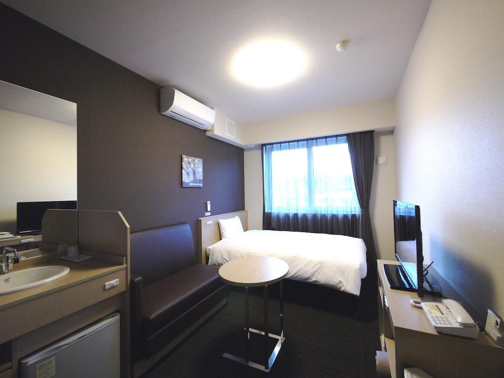 Hotel Route-Inn Tome Habitación foto